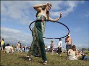 Elizabeth Wrege, of Indianapolis, dances with a hula hoop during
last year's Wakarusa Music and Camping Festival. Festival
organizers are working with Clinton Lake neighbors and the general
public to discuss concerns about this year's festival.