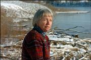 Carey Maynard-Moody, a member of the Sierra Club Wakarusa Group and
the Alliance for the Conservation of Open Space, lists the Kansas
River as one of Lawrence's most treasured natural resources. She's
pictured on the river's banks Wednesday afternoon.