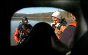 Members of the Douglas County Underwater Search and Recovery Unit
practice recovery techniques Thursday at Clinton Lake, where the
water was about 40 degrees. Team members, from left, are Terry Haak
and Scott Chamberlain.