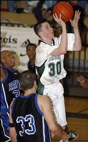 Free State High's Brady Morningstar (30) goes up for a shot against
Olathe Northwest. Morningstar scored 27 points, helping the
Firebirds beat the Ravens, 61-48, Friday night at Free State.