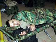 Spc. 1st Class Samuel Aguirre, Iola, of the 891st Engineer
Battalion, catches some sleep between shifts in the tactical
operations center with his M-16 close at hand.<br>
<a href=
"http://etc.lawrence.com/galleries/Bootsonthegr/7748_lores.html"
target="_new" onclick=
"window.open(&squot;http://etc.lawrence.com/galleries/Bootsonthegr/7748_lores.html&squot;,&squot;Photo&squot;,&squot;height=650,width=550,screenX=10,screenY=10,&squot; + &squot;scrollbars,resizable&squot;); return false;">
<img src="http://www.ljworld.com/art/icons/icon_photo.gif" border=
"0" alt="photo"> Photo Gallery: Boots on the ground</a><br>