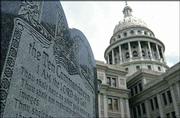 This 5-foot-tall stone slab bearing the Ten Commandments stands
near the Texas Capitol in Austin, Texas. On March 2, the Supreme
Court will hear arguments in a federal lawsuit seeking to remove
this monument and one at a Kentucky courthouse on grounds that they
violate constitutional separation of church and state.