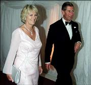 Britain's Prince Charles, right, and Camilla Parker Bowles walk to
the gala dinner at The Prince's Foundation in London on June 20,
2000. Questions over their planned marriage are pulling at Anglican
unity.