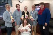 Kris McNish, Lawrence, holds her son, Zackary, at Lawrence Memorial
Hospital where she received books from the Altrusa Club of
Lawrence. The club presented 1,200 books to LMH for new mothers.
The donation is in memory of Ethel Rice. Pictured, from left
standing, are Betty Parks, club member; Lori Michel, club member;
Joyce Steiner, youth services coordinator at Lawrence Public
Library, Nancy Hambleton, club member; and Isabel Schmedemann,
director of the maternal/child department at LMH.
