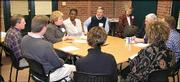 Kim Bodensteiner, third from left, speaks during a media session
for the 2005 Leadership Lawrence class. Other class members,
pictured clockwise around the table from Bodensteiner, are Ndeye
Ceesay, Kevin Boatright, Hank Booth, Doug Gaumer, Maria Martin,
Kiersten Gens, Jamie Lowe and Brad Chindamo. The class met Jan. 27
at the News Center. Pictured in back at right is Charlene Droste,
session coordinator.
