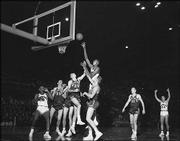 Wilt Chamberlain towers above the rest of the players in his file
photo from his college debut. He had 52 points in the game, an
87-69 victory over Northwestern.