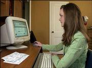 High school senior Robin Lindquist navigates an H&R Block Web
site offering free online tax preparation for young adults at her
parent's home in Prairie Village. The program, offering free online
services to workers 18 and under who earn less than $10,000, is
part of a growing trend among tax preparers catering to young
people.