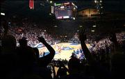 Kansas University fans are silhouetted against the Kansas University/Texas game Jan. 29 at Allen Fieldhouse. KU is celebrating the fieldhouse's 50th "birthday" this week.
