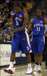 Kansas University's Keith Langford (5) winces as he leaves the
Jayhawks' 72-68 loss to Missouri because of an ankle injury.
Langford played just three minutes in the setback Sunday in
Columbia, Mo., and his status for Friday's Big 12 Conference
tournament opener is in doubt.