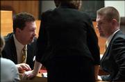 Dist. Atty. Charles Branson, left, and Assistant Dist. Atty.
Brandon Jones, right, confer in Douglas County District Court
before the preliminary hearing for Martin K. Miller. Miller is
charged with killing his wife, Mary Miller.