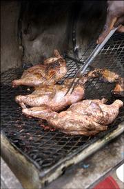 Allspice, Scotch bonnet peppers and thyme are common spices in the
wide variety of jerk seasoning used to barbecue chicken. Other
ingredients that are often added include: garlic, scallions,
ginger, cloves, cinnamon and black pepper.<br>
<a href=
"http://etc.lawrence.com/galleries/jerkcooking/8435_lores.html"
target="_new" onclick=
"window.open(&squot;http://etc.lawrence.com/galleries/jerkcooking/8435_lores.html&squot;,&squot;Photo&squot;,&squot;height=650,width=550,screenX=10,screenY=10,&squot; + &squot;scrollbars,resizable&squot;); return false;">
<img src="http://www.ljworld.com/art/icons/icon_photo.gif" border=
"0" alt="photo"> Photo Gallery: Island spice</a><br>