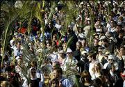 Christian pilgrims walk down the Mount of Olives in Jerusalem, some
holding palm leaves, during the traditional Palm Sunday procession.
Palm Sunday, which begins Christianity's most solemn period, marks
Jesus' entrance into Jerusalem, when his followers laid palm
branches in his path.