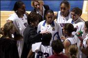 Bonnie Henrickson provides instruction during the pregame huddle
against Dartmouth. KU beat the Big Green, 84-51, on Dec. 18 at
Allen Fieldhouse.