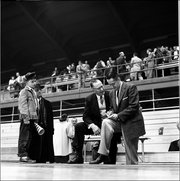 1950's: Phog Allen, basketball coach at University of Kansas, talking with Bill Mayer, in Lawrence, KS.