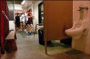 An upcoming bond issue deals with, among other things, the locker
rooms at Lawrence High School, where girls have to pass through the
boys' locker room to reach the weight room.