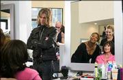 Jorge (Kevin Bacon) looks on as Gina (Queen Latifah) and Lynn
(Alicia Silverstone) finish with a client in the MGM Pictures
comedy "Beauty Shop." The film opened Wednesday in Lawrence.
