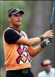 Jesper Parnevik tees off in this file photo from Sunday. Parnevik
is one of many golfers setting new fashion trends on the tour with
their bright and colorful apparel.