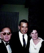 Author Truman Capote, left, wanted to be the center of attention at
parties such as this one at the Odd Williams home in Lawrence in
1966. To the right are KBI agent Alvin Dewey Jr. and his wife,
Marie.<br>
<a onclick=
"window.open(&squot;http://www2.ljworld.com/photos/galleries/2005/apr/03/in_cold_blood_a_legacy_in_photos/166/&squot;, &squot;PhotoGallery&squot;, &squot;width=650,height=650,scrollbars=yes,resizable=yes&squot;); return false;"
href=
"http://www2.ljworld.com/photos/galleries/2005/apr/03/in_cold_blood_a_legacy_in_photos/166/">
<img src="http://www.ljworld.com/art/icons/icon_photo.gif" border=
"0" alt="text"> See slide show »</a>