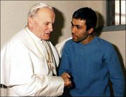 Pope John Paul II converses with his would-be assassin, Turkish
terrorist Mehmet Ali Agca, in Agca's prison cell in Rome in this
Dec. 27, 1983, file photo.