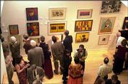 The annual lawrence art auction will be Saturday at the Lawrence
Arts Center, 940 N.H. Doors open at 6 p.m., and the live auction
begins at 7:30 p.m. Above, patrons browse artwork at the 2003
Lawrence Art Auction.