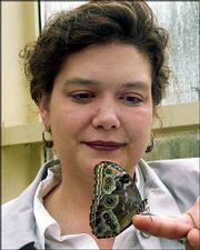Nicole Gamble, manager of the butterfly center at Callaway Gardens,
near Pine Mountain, Ga., holds a blue morpho butterfly. Callaway's
tropical butterfly conservatory reopened recently after a $2
million expansion.