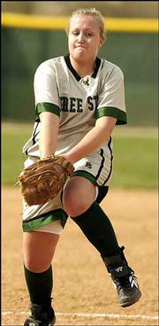 Free State high pitcher Ashley Wagner winds up for a pitch against
Olathe South. The Firebirds swept a doubleheader Friday at Free
State.