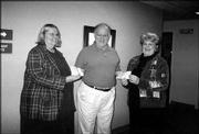 Grand Knight John Callewaert, center, presents checks to Barbara
Bishop, left, of ARC of Douglas County, and Peggy Wallert, of
Cottonwood Inc. The organizations each received $1,853.65. The
Knights donated money that was raised during October's Tootsie Roll
drive.