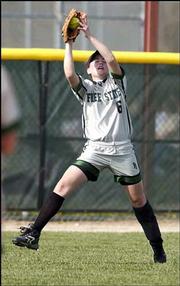 Free State High's Sachi Sakumura makes a catch in right field
against Shawnee Mission Northwest. The Firebirds lost a
doubleheader Friday at Free State.