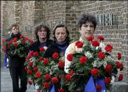 Women carrying wreaths walk in front the Wall of Nations during the
commemoration ceremony marking the 60th anniversary of the
liberation of the Nazi concentration camp of Ravensbrueck in
Fuerstenberg, Germany. About 450 survivors gathered Sunday to
commemorate the liberation by the Soviet Army in April 1945.