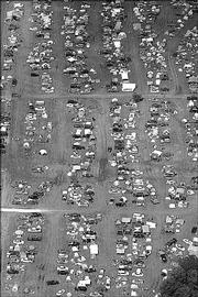 A TENT CITY IS CREATED NEXT TO PARKED VEHICLES last June at the Wakarusa Music and Camping Festival at Clinton Lake.