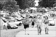 CAMPERS MILL ABOUT last summer at the Wakarusa Music and Camping Festival at Cliinton Lake. This year's festival is planned for June 17-19.