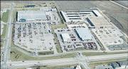 THE FORMER HOME OF PAYLESS CASHWAYS, far right, will be the new home for Crown Toyota on south Iowa Street. The 12-acre site will provide room for twice as many cars than the current Crown Toyota business, center. Wal-Mart, upper left, gets the Crown building and parking lot.