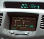 A monitor shows the energy status of one of the city's Toyota
Priuses. Hybrids use an electronic motor until the cars get up to
about 25 miles per hour, then they switch to the gasoline engine.