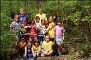 Girl Scout Troop 656 leaders Trish Pflummerfelt, back row left, and
Debby McNemee, back row right, and their Scouts helped during a
spring cleanup April 10 at Hidden Valley Camp, just northwest of
the corner of Kasold Drive and Bob Billings Parkway.