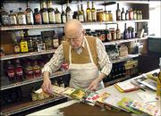 Ben Rich prepares a display of the cards in his grocery store, in
St. Joseph, Mo., March 31. Rich said he had received birthday cards
for his 90th birthday from people he had not heard from in years.
Rich's store has been in business for more than 50 years.