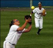 Kansas University's Destiny Frankenstein, left, hauls in a pop fly
against Missouri. KU fell to the Tigers, 3-0, Wednesday at Arrocha
Ballpark.