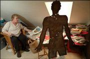 Patricia Elliott Marvin is having a garage sale that will feature
books and memorabilia of Beat writer and late Lawrence resident
William S. Burroughs. Marvin, an acquaintance of Burroughs, has
several signed items, including a metal sculpture created by
Burroughs and David Bradshaw that was riddled with bullet holes by
Burroughs.