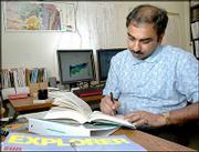 Saibal Bhattacharya, petroleum engineer and energy researcher with
the Kansas Geological Survey, and a Hindu, is critical of efforts
to introduce intelligent design into the science classroom.
Bhattacharya worked in his office Wednesday at the KGS offices on
KU's west campus.