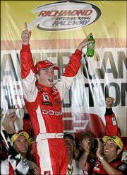 Kasey Kahne celebrates after winning the Chevy American Revolution
400. He won the Nextel Cup race Saturday night at the Richmond
International Raceway in Richmond, Va.
