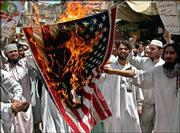 Pakistani protesters burn a U.S. flag to condemn alleged
desecration of Islam's holy book, the Quran, at the U.S. prison in
Guantanamo Bay, Cuba. The protest was Sunday in Peshawar, Pakistan.
Newsweek magazine, which had published a story describing acts of
desecration, on Sunday said its story was in error and apologized
for the mistake.