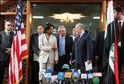 U.S. Secretary of State Condoleezza Rice reaches out to shake hands
with Iraqi Prime Minister Ibrahim al-Jaafari at a press conference
in Baghdad. Rice arrived Sunday under very heavy security to meet
Iraqi leaders grappling with a wave of insurgent attacks that have
killed more than 400 people since a new government was formed on
April 28.