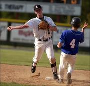 Free State High's Robby Price, left, turns a double play after forcing out Leavenworth runner Mitch Lozenski. The Firebirds beat the Pioneers, 13-1, before beating Topeka High to advance to the state tournament on Thursday at Free State.