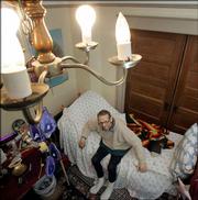 Cancer patient Christopher Campbell rests at his home in Portland, Ore. Campbell, who has a medical marijuana card, said Monday he would not cease using the drug to quell his pain and improve his appetite. "It's not going to stop me, that's for sure," said Campbell, 58, of the Supreme Court ruling. Campbell suffers from lymphoma and has had his spleen and portions of his pancreas and stomach removed.