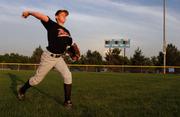 12-U Rebels player Matt Wade warms up before a game against the KC Varsity June 9 at the Prairie Center Complex in Olathe. The Varsity defeated the Rebels 4-0.
