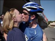 Lindsey Kelly, Prescott Valley, Ariz., gives her husband, Ryan, a kiss after his arrival at the Kansas Army National Guard office, 2223 La.