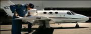 Test pilots Scotty Jergenson, left, and David Bonifield conduct an inspection this week before a test flight in a Cessna Citation Mustang business jet in Wichita.