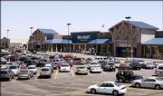 A Super Wal-Mart store is pictured in Centennial, Colo., featuring a timber roof style to suit the community's standards. Faced with controversy when it moves into new towns, Wal-Mart has created a new prototype that features a broken plane - different levels of roof tops - enabling it to be more easily customized to different communities.