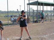 Emma Kloster gets the signal from her coach to swing away in the top of the third inning. The Smurfs needed all the offense they could get, but went on to lose to the Black Beauties 21-8, on June 22 at Youth Sports Inc.