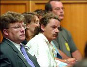 Steve Relford leans forward to look at Dennis Rader (not shown) as Rader pleads guilty to 10 counts of first degree murder. Rader appeared Monday in Sedgwick County District Court. Relford's mother, Shirley Vian, was killed by Rader in March 1977. Rader, who admitted killing 10 people in the Wichita area between 1974 and 1991, taunted media and police with cryptic messages calling himself "BTK," for "Bind, Torture, Kill."