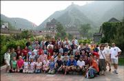 Members of the Kansas University Wind Ensemble visiting China are shown at the Great Wall. Director John Lynch is shown fourth from the right in the back row, wearing sun glasses. Nine additional KU faculty members accompanied the 59-member band.